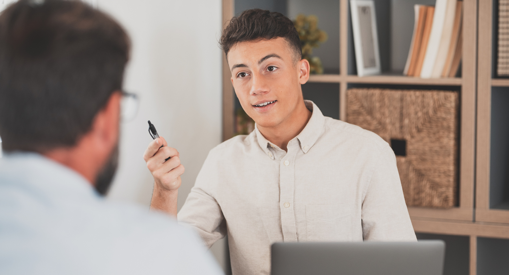 apprentice at work holding a pen