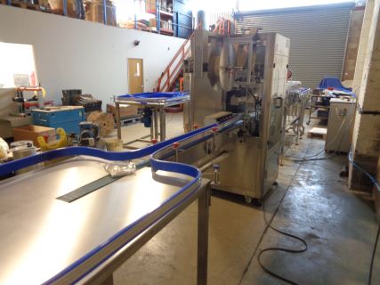Newlink TB-250 Automatic Bottle Sleeving Machine (2023) and a Pel 5500 Baler